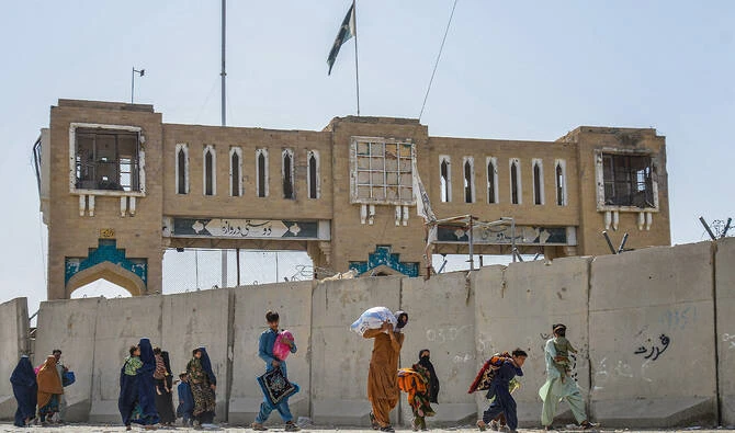 Afghan refugees deported from Pakistan arrive with their belongings at the zero point border crossing between Afghanistan and Pakistan in the Spin Boldak district of Kandahar province on October 19, 2025. (AFP)