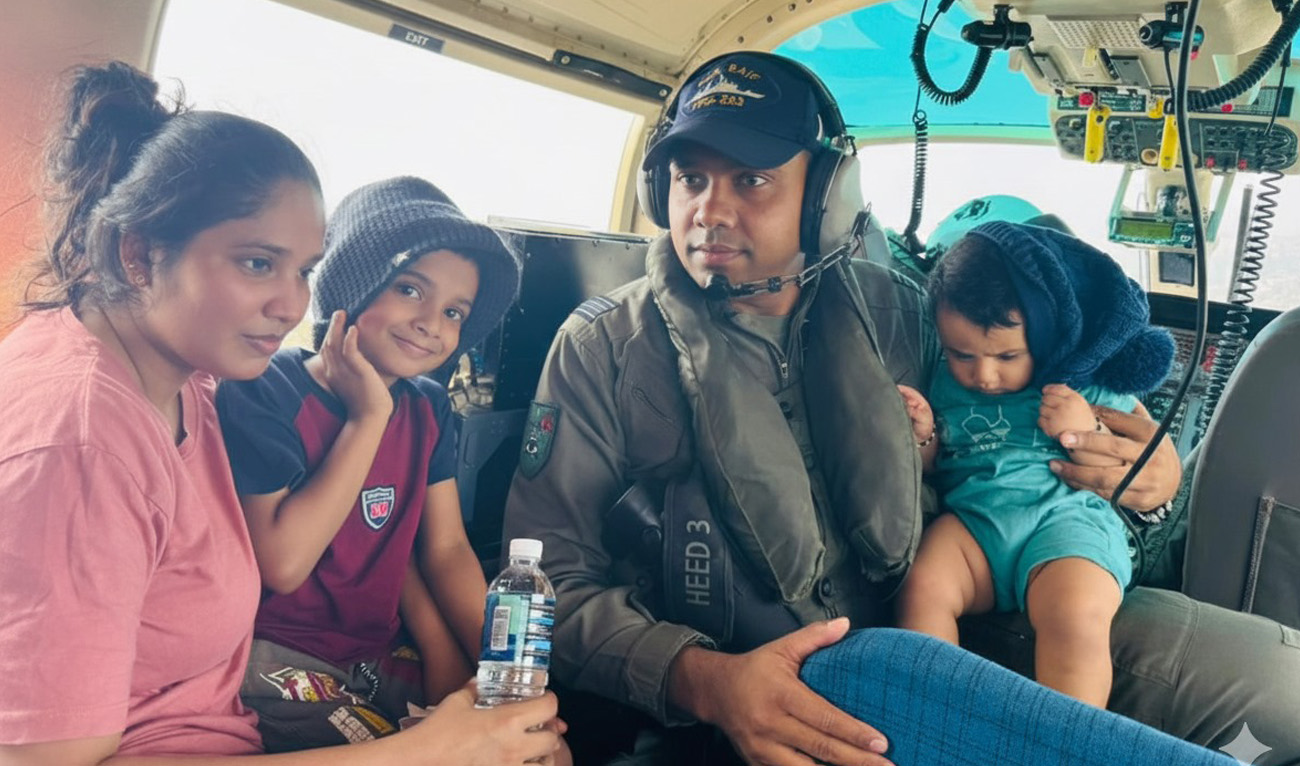 In this handout photo, taken and released by Director General Public Relations on December 1, 2025, Pakistan Navy officer gestures with Sri Lankan family following a rescue operation in Kotikawatta. (Handout/Pakistan Navy)