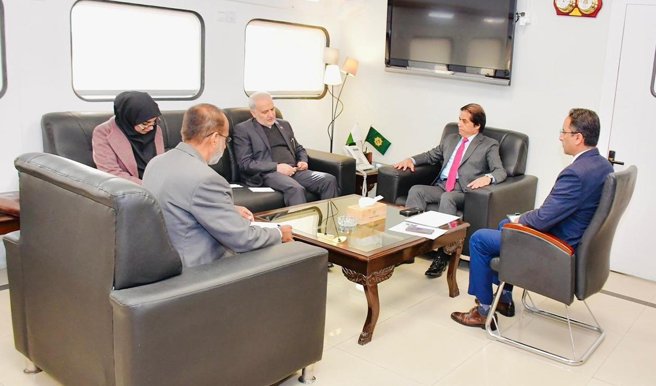Pakistan's Railways Minister, Hanif Abbasi (second-right) in conversation with Iranian Ambassador to Pakistan Dr. Reza Amiri Moghaddam (center) in Islamabad on December 4, 2025. (PID)