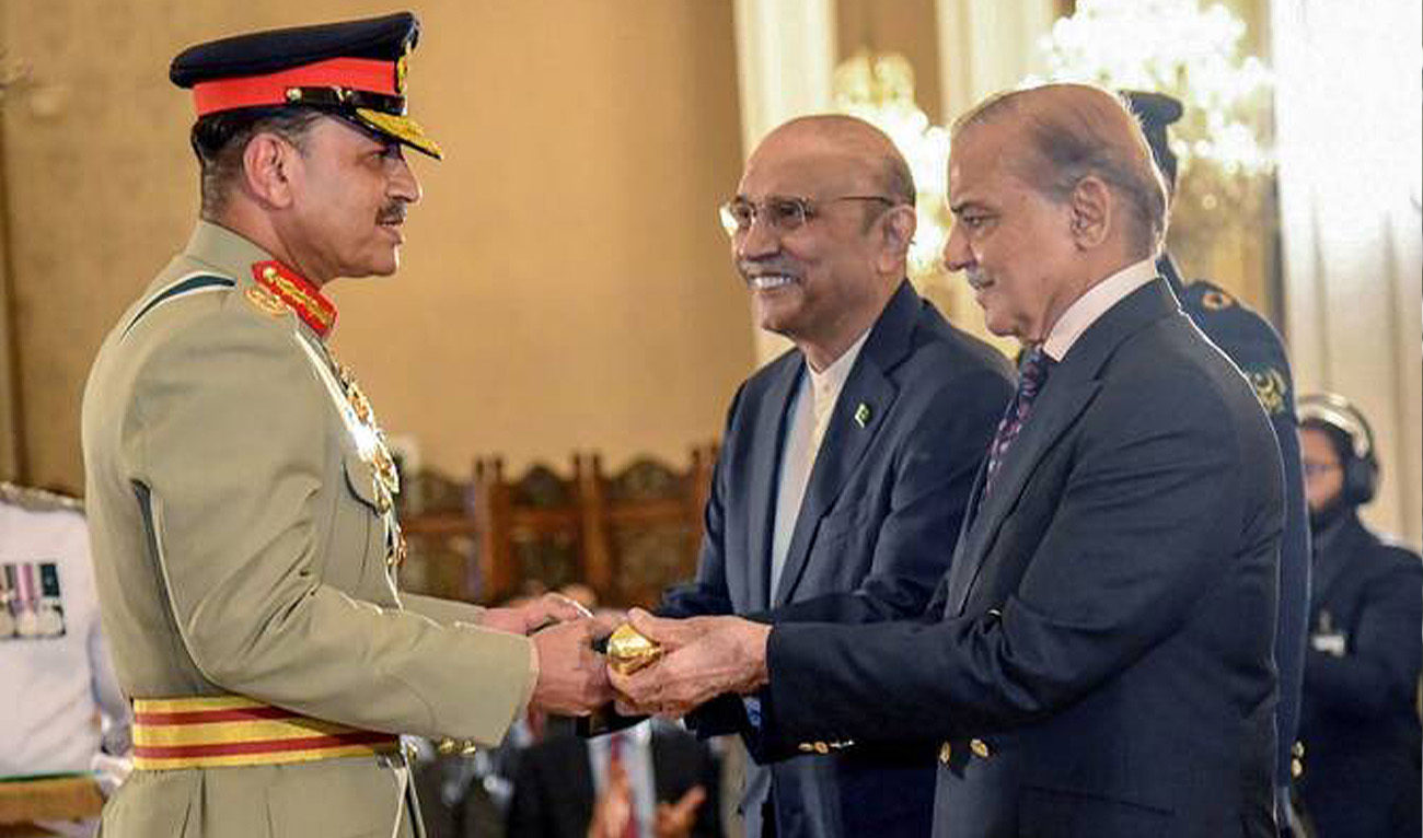 Chief of Army Staff Asim Munir, left, receives the Baton of Field Marshal from Pakistan’s Prime Minister Shehbaz Sharif, right, and President Asif Ali Zardari on May 22, 2025. (Pakistan’s Press Information Department/AFP)