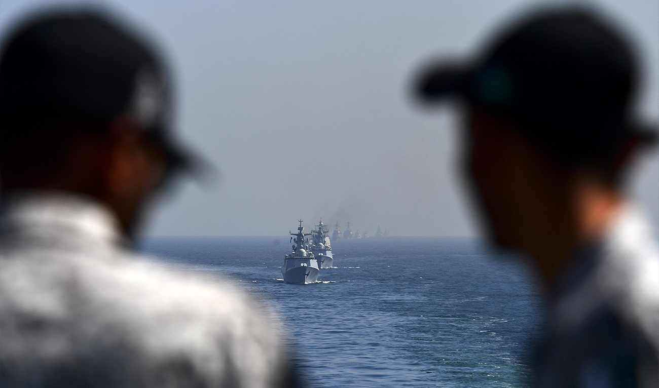 Pakistan's soldiers look at Naval ships of participating countries take part in a multinational naval exercise 'AMAN-23' in the Arabian Sea near Pakistan's port city of Karachi on February 13, 2023, as more than 50 countries participating with ships and observers. (AFP/ file)