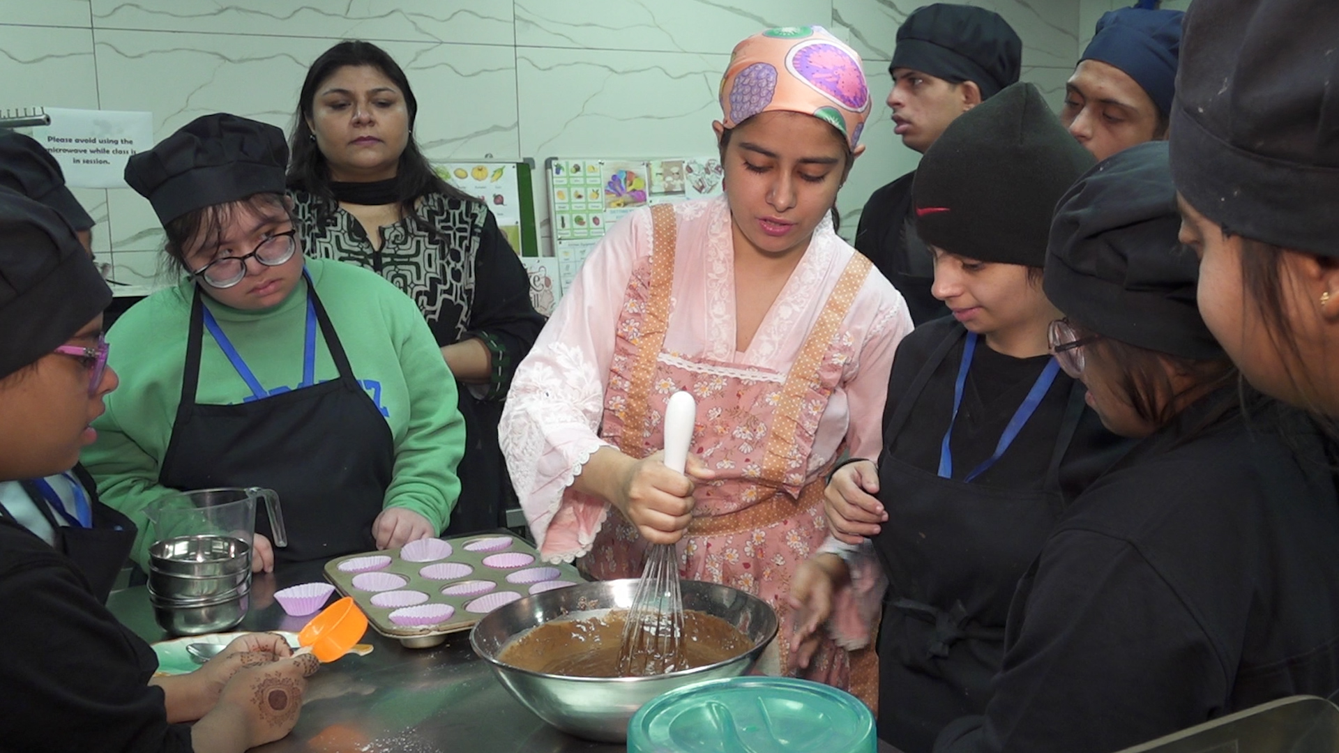 Zainab Durrani, the culinary and pastry instructor, is teaching students in Karachi, Pakistan, on December 12, 2025. (AN Photo)