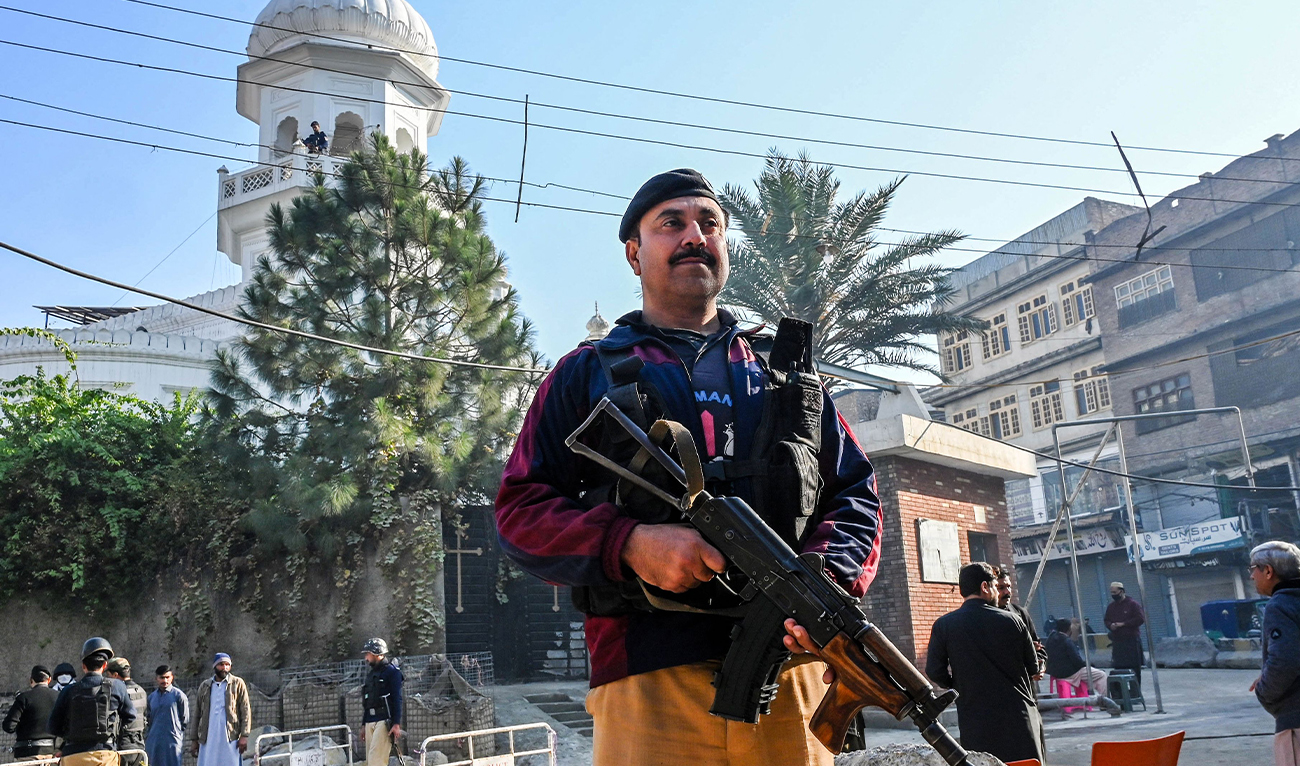 Police personnel stand guard on the occasion of Christmas outside All Saints’ Church in Peshawar, Pakistan, on December 25, 2025. (AFP/File)