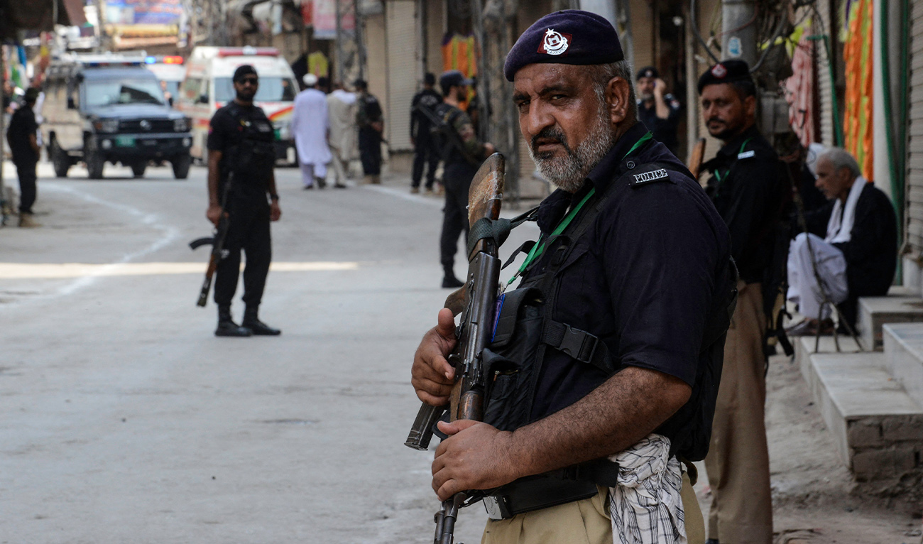 Police stands guard ahead of a Muharram procession in Peshawar on August 7, 2022. (AFP/ file)