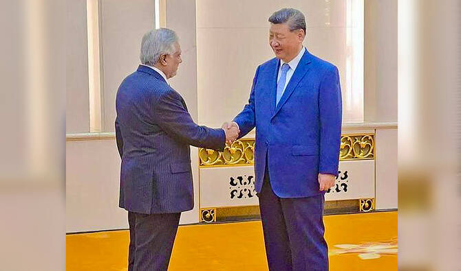 Pakistan's Deputy Prime Minister and Foreign Minister, Ishaq Dar (left) shaking hand with President of China, Xi Jinping, on the sidelines of the SCO Council of Foreign Ministers meeting in China. (@MIshaqDar50/X)