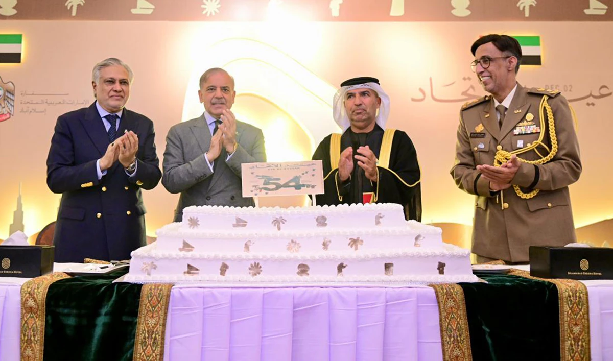 rime Minister Shehbaz Sharif cuts cake at a ceremony of the national day of the United Arab Emirates at the UAE embassy in Islamabad on December 8, 2025. (PMO)