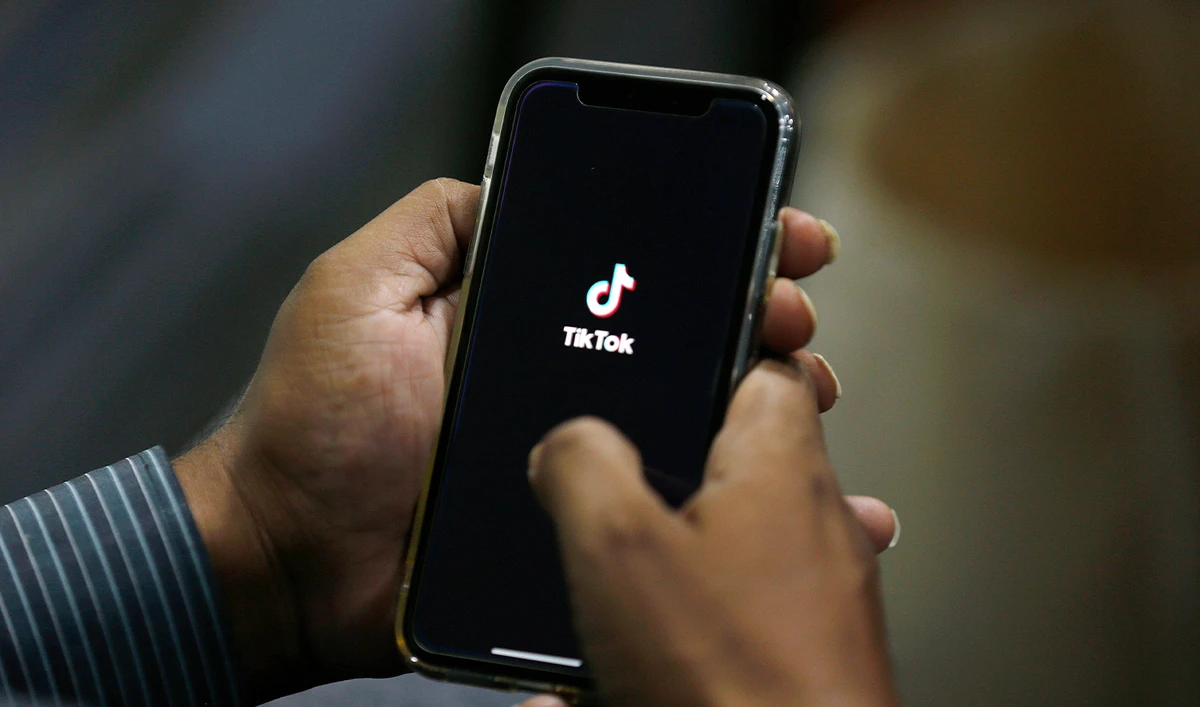 In this July 21, 2020 file photo, a man opens social media app 'TikTok' on his cell phone, in Islamabad, Pakistan. (AP/File)
