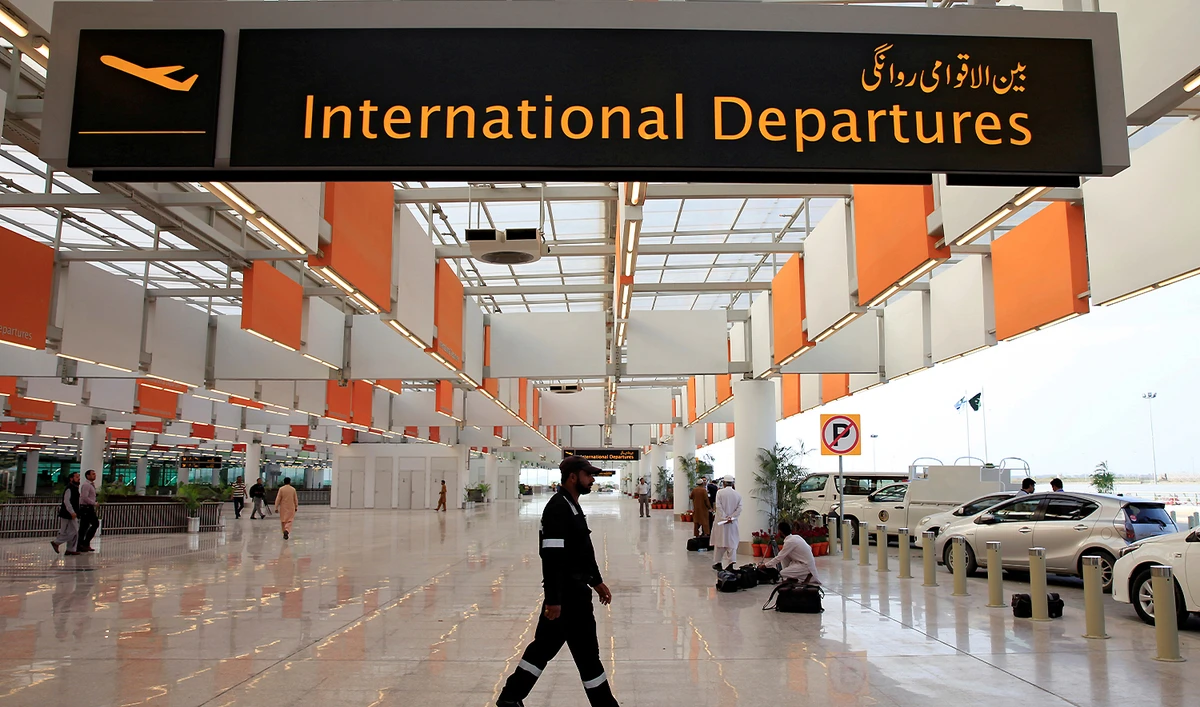 A worker walks at the departure area of Islamabad International Airport in Islamabad on April 18, 2018. (REUTERS/File)