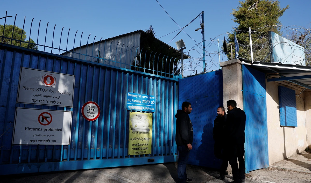 Israeli police officers wait outside the United Nations Relief and Works Agency for Palestine Refugees (UNRWA) headquarters, in Jerusalem on December 8, 2025. (REUTERS)