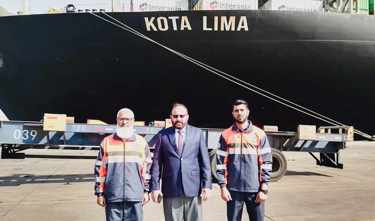 Officials pose for a photograph after receiving the third consignment of Humanitarian Assistance from China at Karachi port, Pakistan, on December 26, 2025. (NDMA)