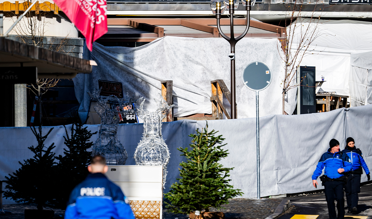 Police officers inspect the area where a fire broke out at the Le Constellation bar and lounge, leaving people dead and injured, during the New Year celebration, in Crans-Montana, Swiss Alps, Switzerland, on January 1, 2026. (AP)