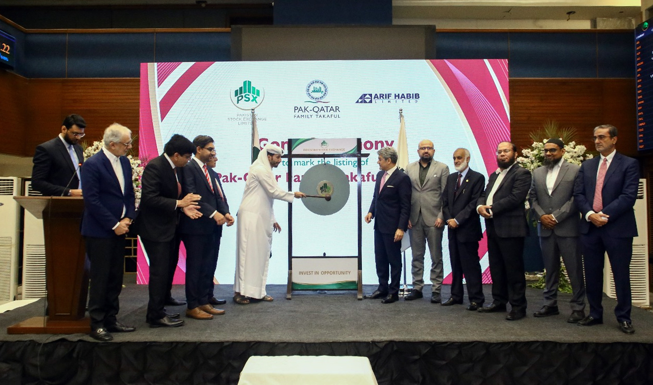 Officials ring the bell at the Pakistan Stock Exchange (PSX) for Pak-Qatar Family Takaful Limited’s first day of trading in Karachi on December 31, 2025. (PQFTL)