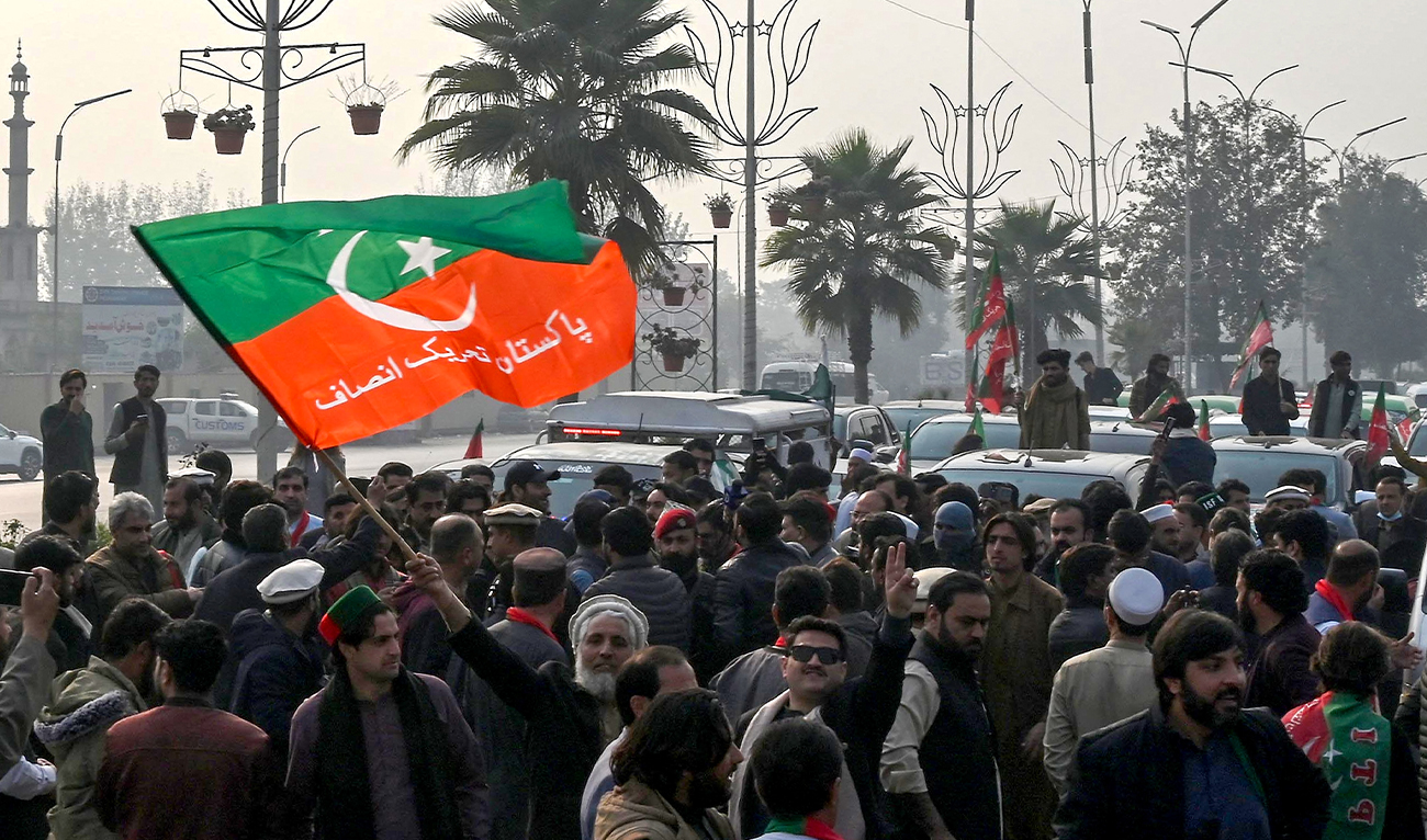 Pakistan Tehreek-e-Insaf (PTI) party supporters protest to demand the release of their jailed leader and former Prime Minister Imran Khan, in Peshawar, Pakistan, on December 2, 2025. (AFP/File)