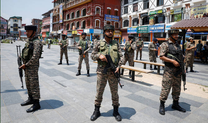 Indian security personnel stand guard on a street during the sixth anniversary of the revocation of Jammu and Kashmir’s partial autonomy, splitting the state into the two federally administered territories of Jammu and Kashmir and Ladakh, in Srinagar, Indian-administered Kashmir on August 5, 2025. (REUTERS/File)