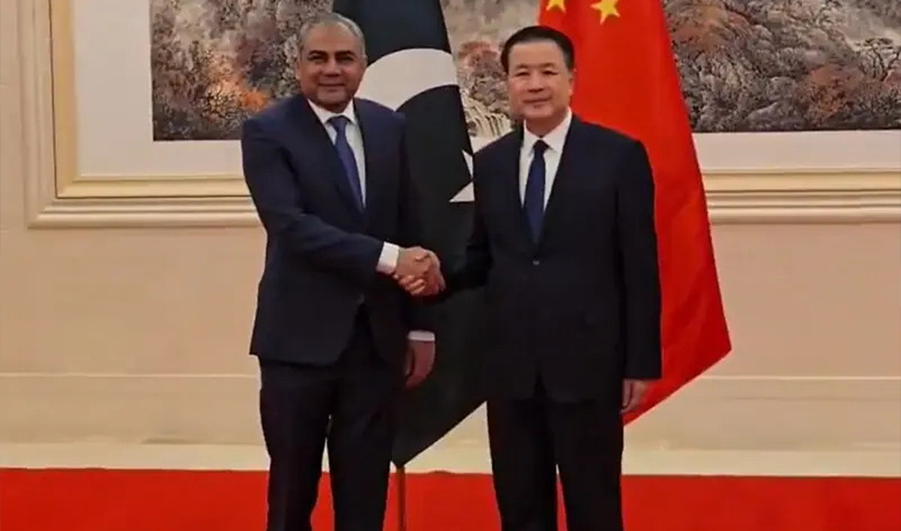 The screengrab taken from a video shows Pakistan’s Interior Minister Mohsin Naqvi and his Chinese counterpart Wang Xiaohong shaking hands at the headquarters of China’s Ministry of Public Security in Beijing on January 7, 2025. (Ministry of Interior)