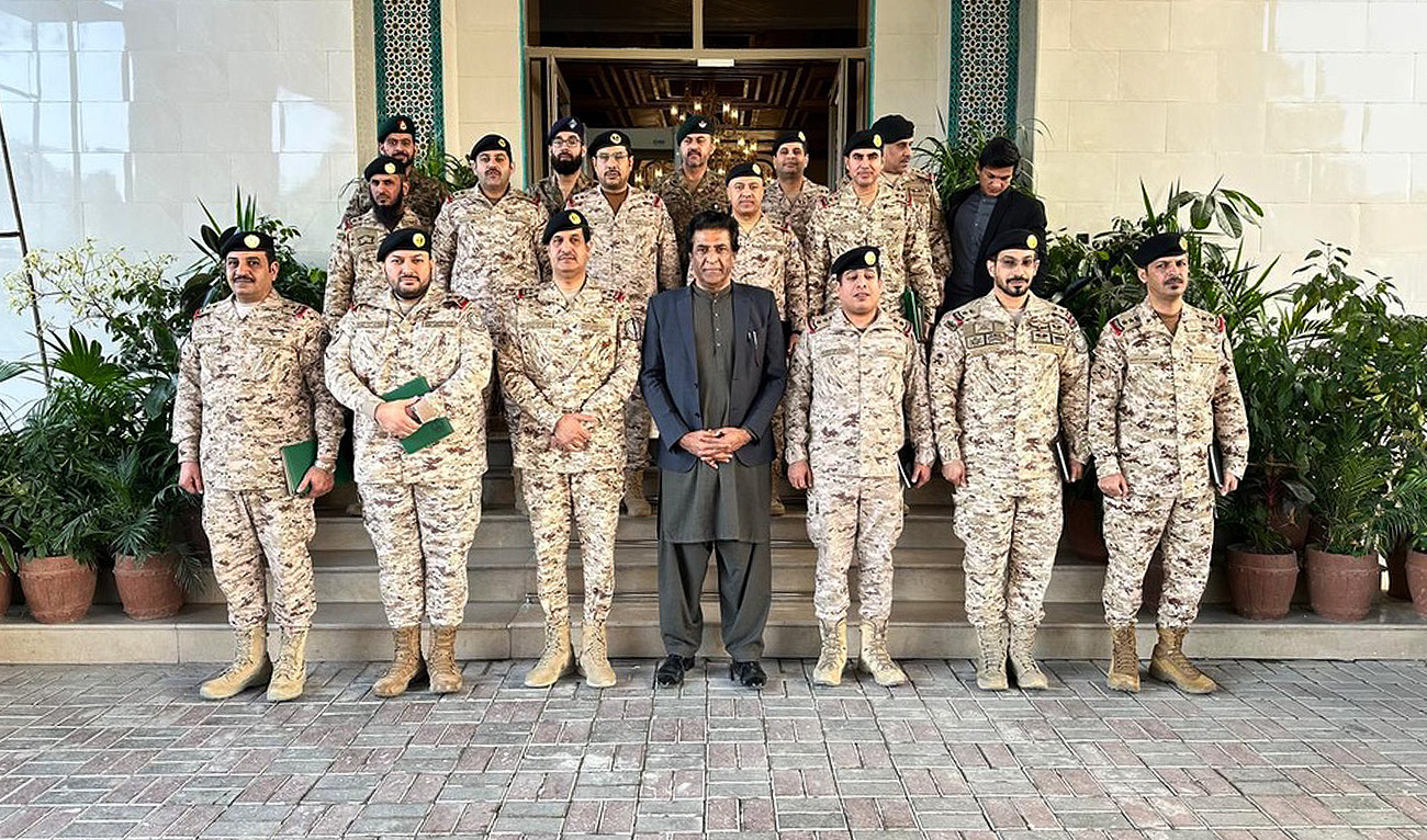 In this handout photograph, taken and released by Pakistan’s foreign office on January 9, 2026, Saudi delegation gesture for a group photo at the Ministry of Foreign Affairs in Islamabad. (Handout/MoFA)