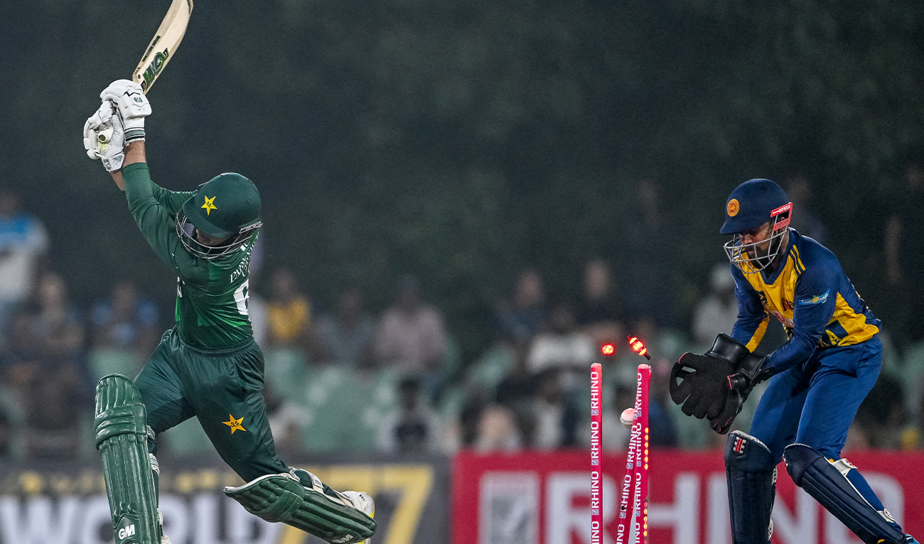 Pakistan's Saim Ayub (L) is clean bowled by Sri Lanka's Maheesh Theekshana during the first Twenty20 international cricket match between Sri Lanka and Pakistan at the Rangiri Dambulla International Stadium in Dambulla on January 7, 2026. (AFP)