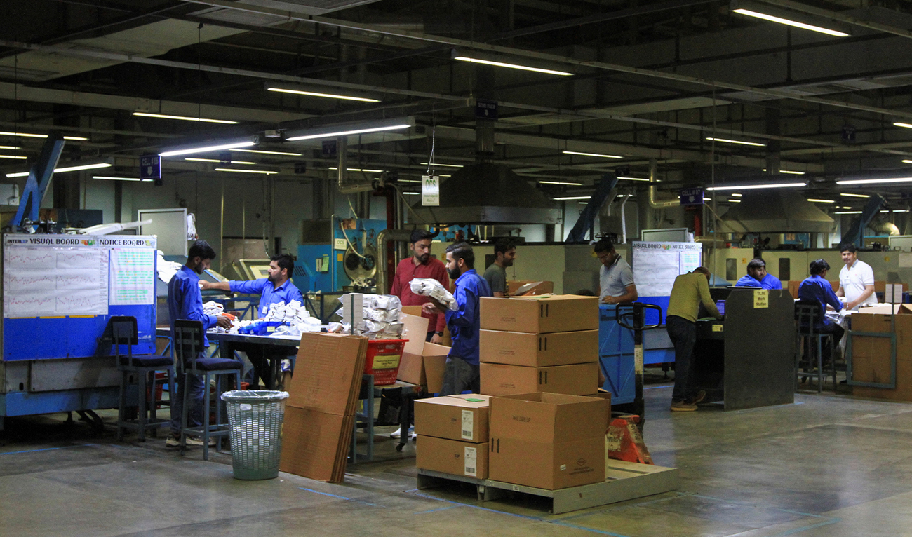 Workers check socks produced at the Interloop industrial park in Faisalabad, Pakistan April 8, 2025. (Reuters)