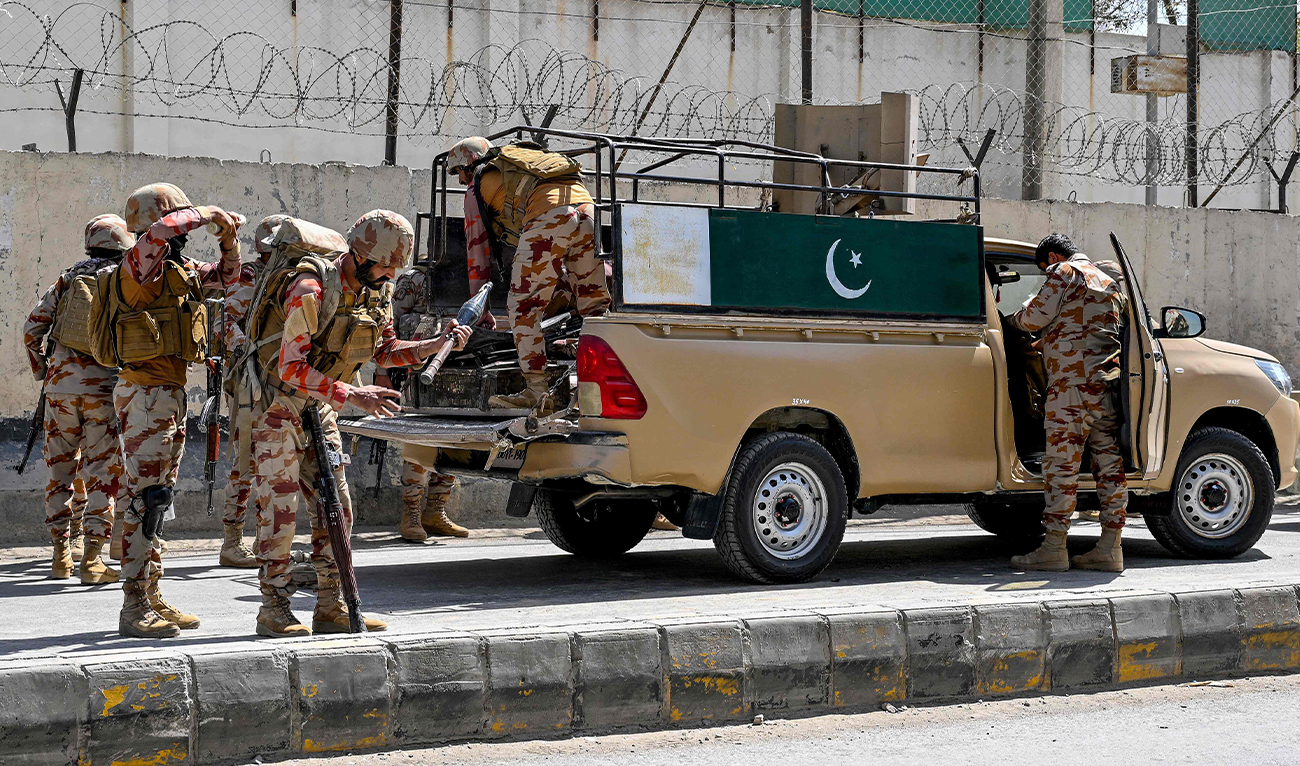 Security personnel stand armed beside a military vehicle in Quetta, Pakistan, on September 30, 2025. (AFP/File)