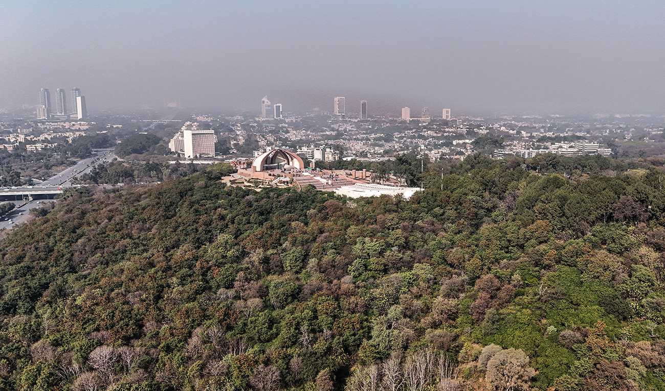 An aerial view shows the Pakistan Monument (C) enclosed by the Shakarparian jungle in Islamabad on January 7, 2026. (AFP/ file)