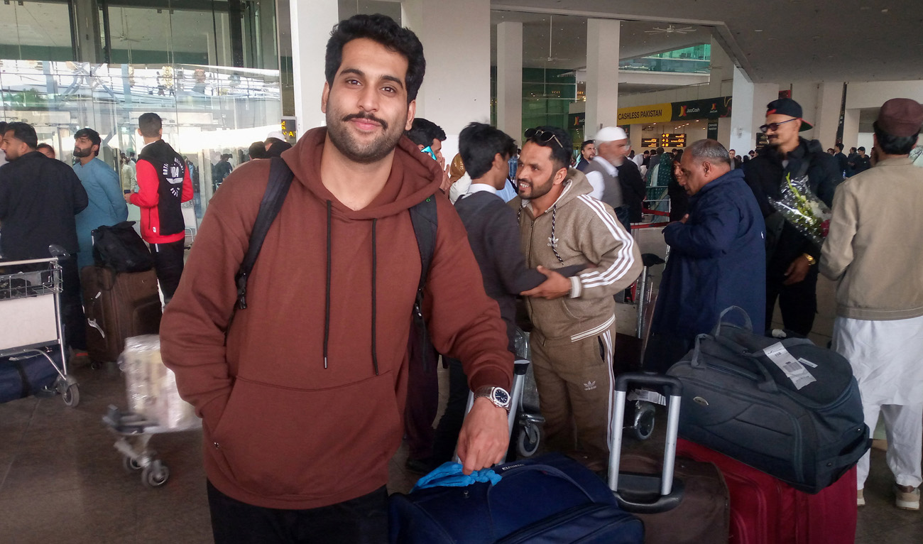A Pakistani medical student Arslan Haider waits at the airport after arriving from Tehran on a commercial flight amid the ongoing nationwide protests in Iran, in Islamabad. (REUTERS)