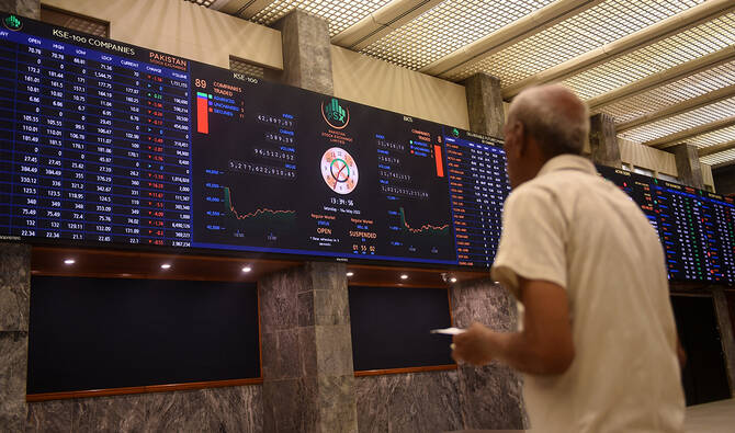 A stockbroker monitors the share prices during a trading session at the Pakistan Stock Exchange (PSX) in Karachi on May 16, 2022. (AFP/ file)