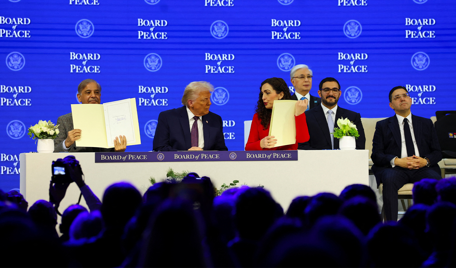 Pakistan's Prime Minister Shehbaz Sharif and President of Kosovo Vjosa Osmani hold signed Charter of the Board of Peace next to U.S. President Donald Trump, as they take part in a charter announcement for his Board of Peace initiative aimed at resolving global conflicts, alongside the 56th annual World Economic Forum (WEF), in Davos, Switzerland, on January 22, 2026. (REUTERS)