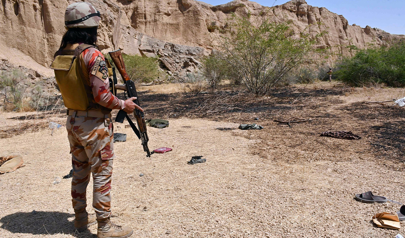 Pakistan’s Frontier Corps stands guard at the siege site after armed militants ambushed a train in the remote mountainous area, at Pehro Kunri in Balochistan province, Pakistan, on March 15, 2025. (AFP/File)