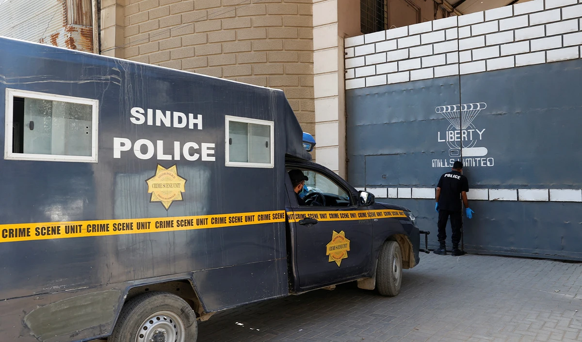 A member of Crime Scene Unit of Sindh Police stands on the main entrance of a factory where, according to police, two Chinese nationals were shot and injured, in Karachi, Pakistan on November 5, 2024. (Reuters/File)