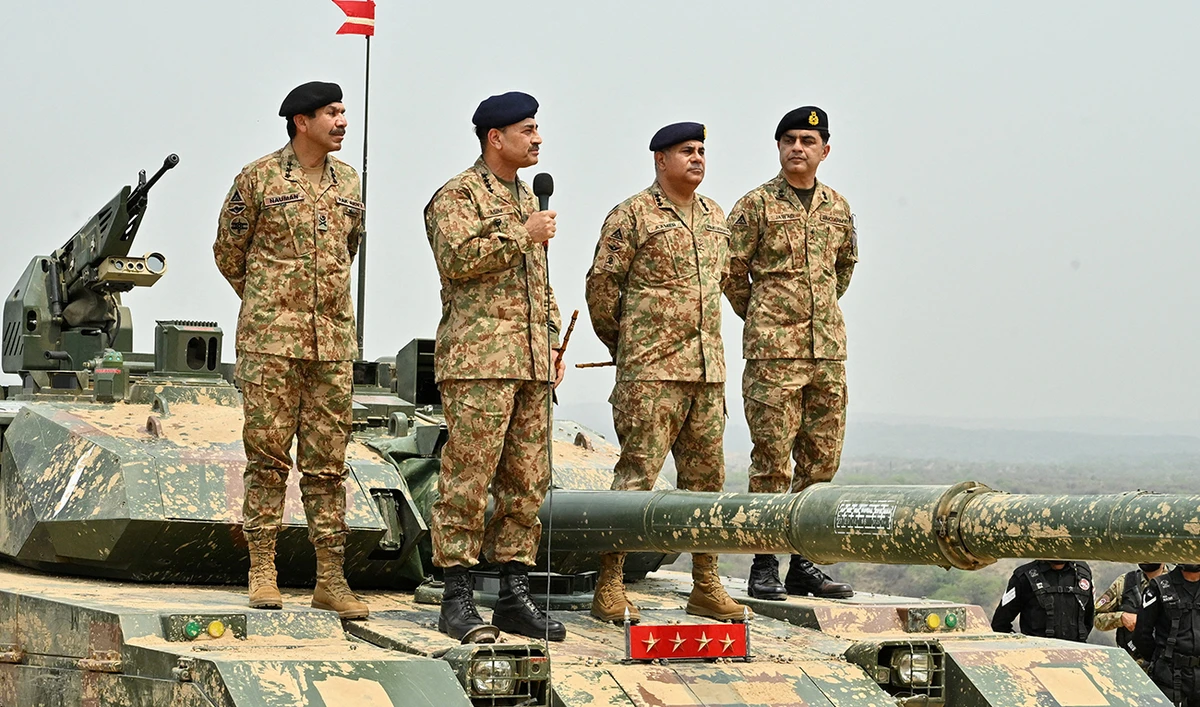 Chief of Army Staff of Pakistan Asim Munir holds a microphone during his visit at the Tilla Field Firing Ranges (TFFR) to witness the Exercise Hammer Strike, a high-intensity field training exercise conducted by the Pakistan Army's Mangla Strike Corps, in Mangla, Pakistan May 1, 2025. (AFP/ file)