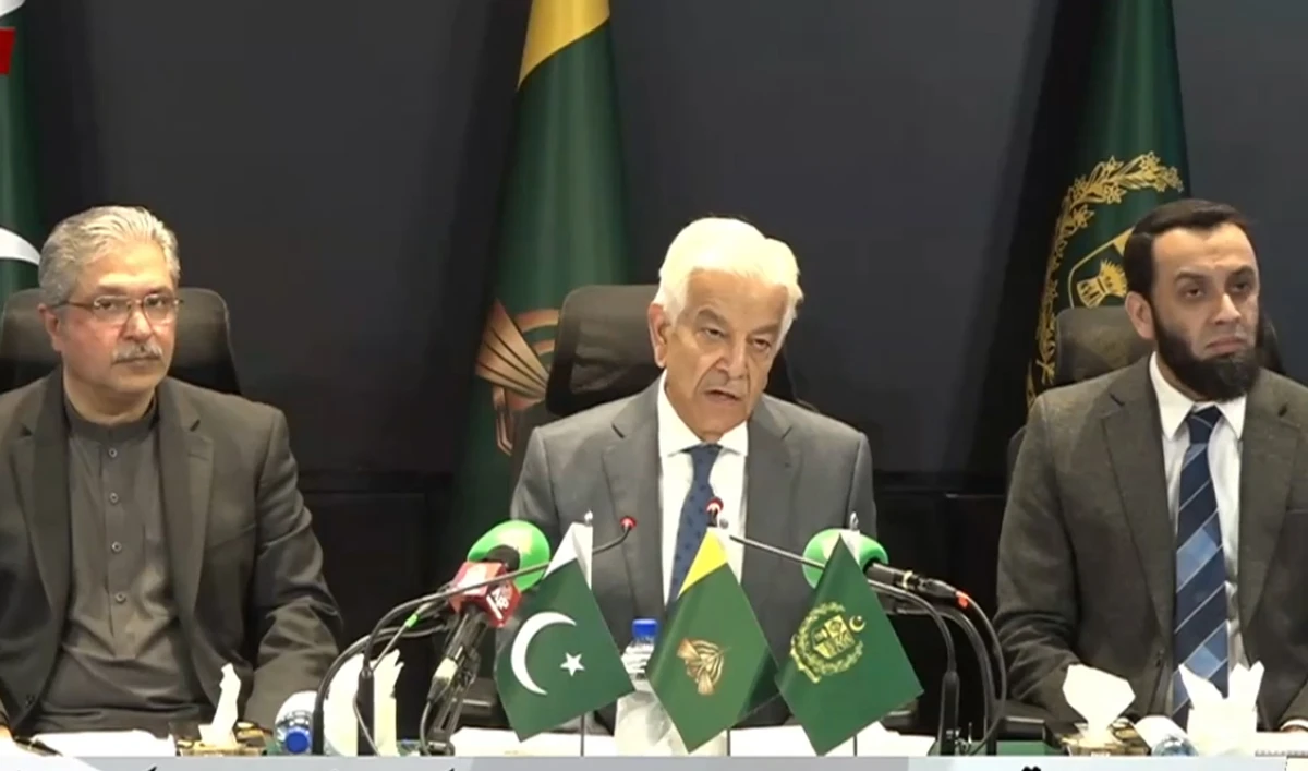 Information Minister Attaullah Tarar (Right), Defence Minister Khawaja Asif (Center), and Special Assistant to the Prime Minister for Information and Khyber Pakhtunkhwa Affairs Ikhtiar Wali Khan (Left) address a press conference in Islamabad on January 27, 2026. (Screengrab/YouTube/PTV News)