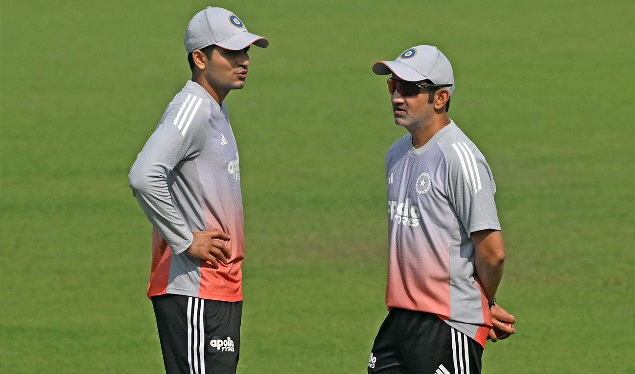 India’s captain Shubman Gill (left) and head coach Gautam Gambhir interact during a practice session on the eve of their first Test cricket match against South Africa, at the Eden Gardens in Kolkata on November 13, 2025. (AFP/File)