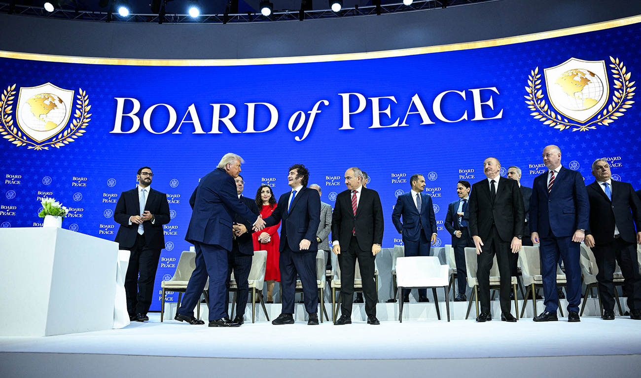 US President Donald Trump (2L) shakes hands with Argentina's President Javier Milei at the "Board of Peace" meeting during the World Economic Forum (WEF) annual meeting in Davos on January 22, 2026. (AFP/ file)