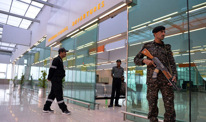 Pakistani security officials from the Airport Security Force (ASF) stand guard at the Islamabad International Airport in Islamabad, Pakistan, on April 18, 2018. (AFP/File)