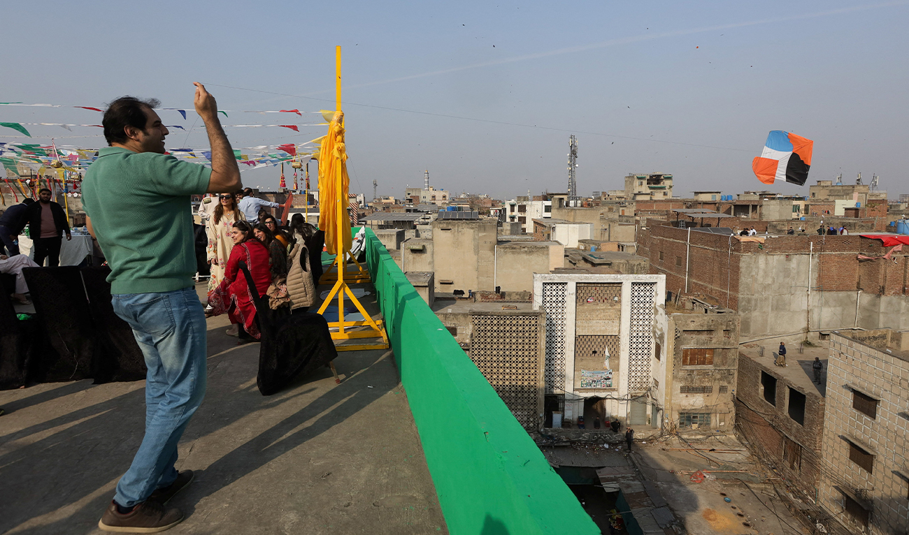 A man flies a kite from a rooftop to mark Basant, a kite-flying festival, in Lahore, Pakistan February 6, 2026. (REUTERS)