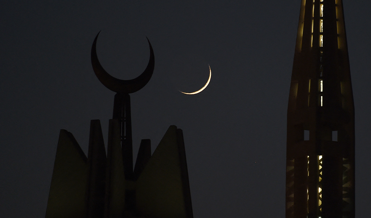 The first Ramadan moon rises over the giant Faisal Mosque in Islamabad on May 27, 2017. (AFP/File)