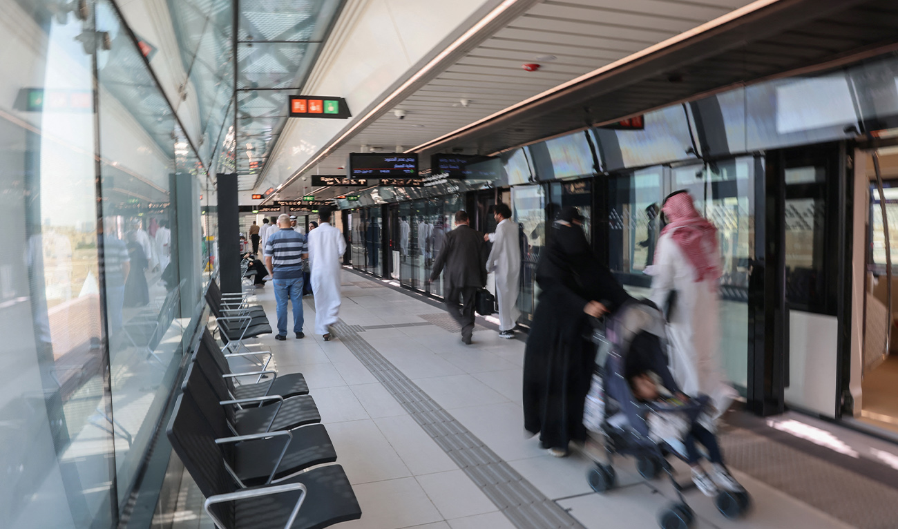 People exit a metro train at King Saud University station in Riyadh on April 27, 2025. (AFP/ file)