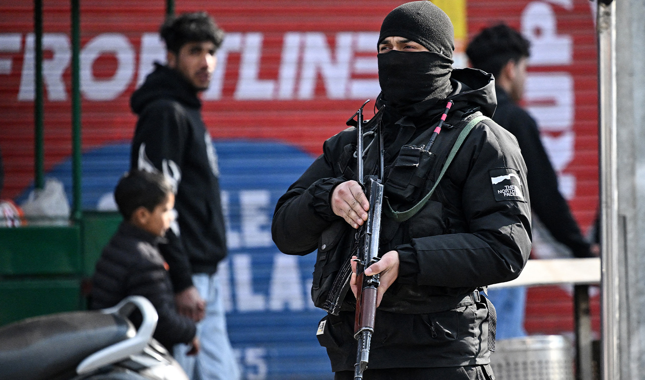 A Special Operations Group (SOG) personnel stands guard along a road in Srinagar on February 13, 2026. (AFP)
