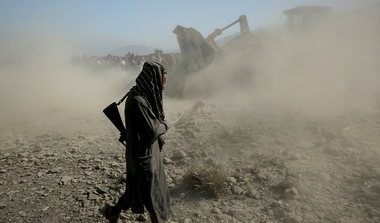Taliban security personnel and residents search for victims after an overnight Pakistani air strike hit a residential area at the Girdi Kas village in Bihsud district, Nangarhar province on February 22, 2026. (AFP/File)