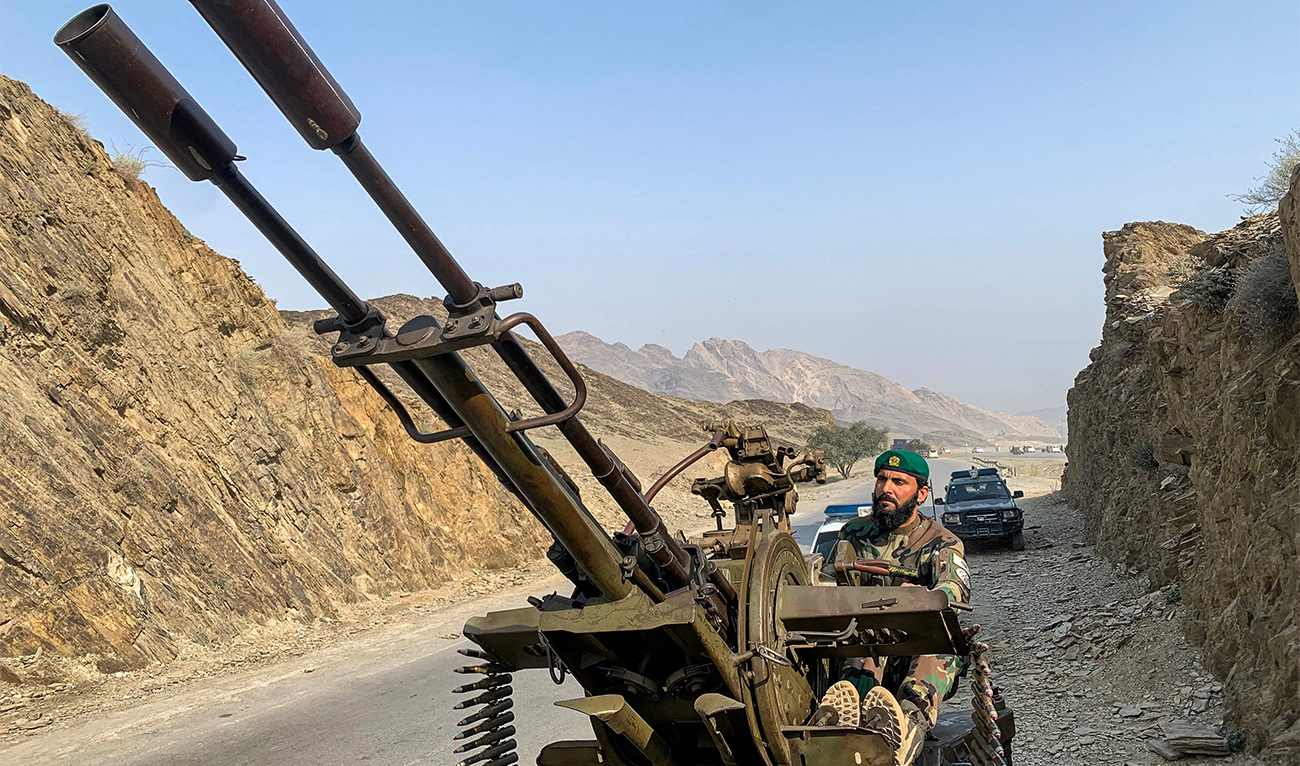 A Taliban security personnel operating an anti-aircraft gun keeps watch for Pakistani airstrikes near the Torkham border crossing between Afghanistan and Pakistan in the Nangarhar province on February 27, 2026. (AFP)