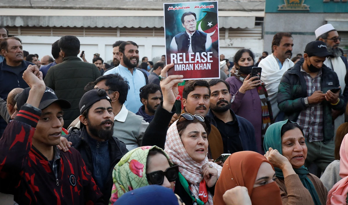 Supporters of jailed former Prime Minister of Pakistan and leader of Pakistan Tehreek-e-Insaf (PTI) party Imran Khan, gather during a protest over concerns about their leader's health, on a road leading to Adiala jail in Rawalpindi, Pakistan, on December 2, 2025. (REUTERS/File)