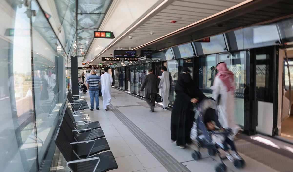 People exit a metro train at King Saud University station in Riyadh on April 27, 2025. (AFP/ file)