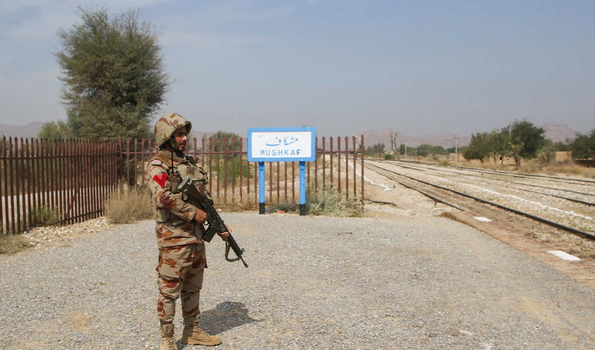 A Pakistan Army soldier stands guard, after the attack on a train by separatist militants in Bolan, at the railway station in Mushkaf, Balochistan, Pakistan, March 12, 2025.(Reuters/File)