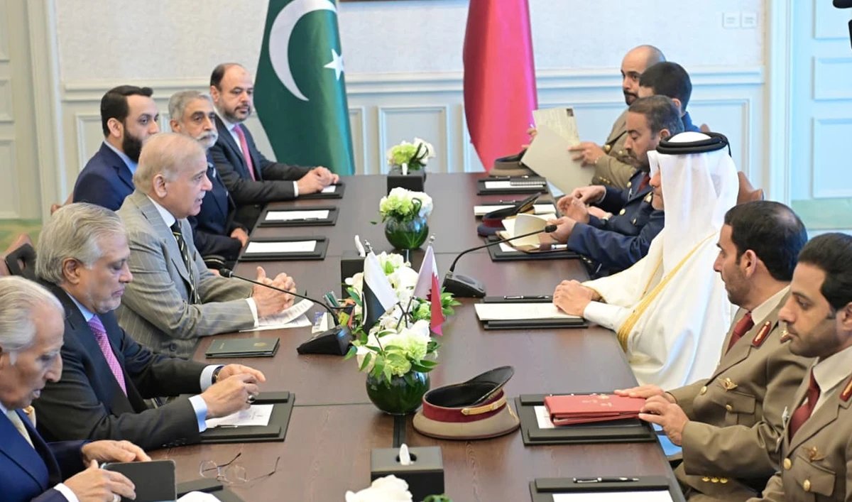 Qatar’s Deputy Prime Minister and Minister of State for Defence Affairs Sheikh Saoud bin Abdulrahman bin Hassan bin Ali Al Thani (left) and Pakistan’s Prime Minister Shehbaz Sharif (right) sit at the center of their respective delegations during a meeting in Doha on February 24, 2026. (@GovofPak/X)