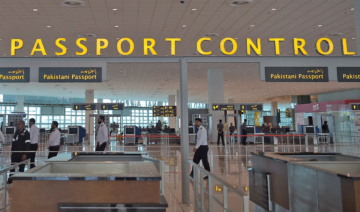 In this photograph taken on April 26, 2018, Pakistani airport staff walk through Islamabad International Airport in Islamabad. (AFP/File)