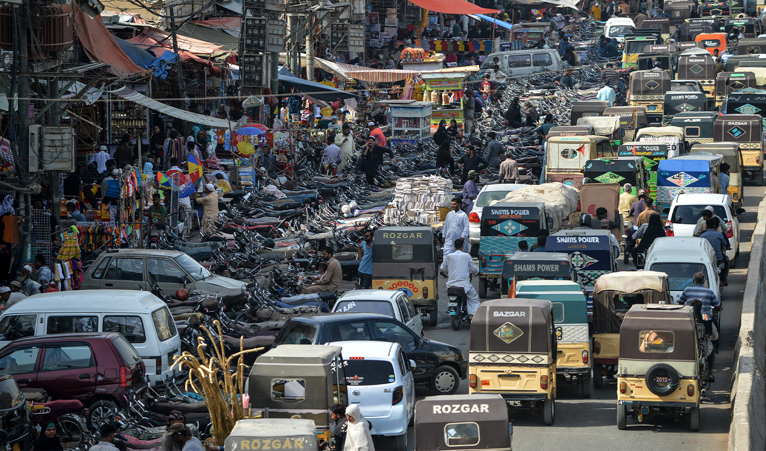 Motorists make their way in a traffic jam alongside a market in the Pakistan's port city of Karachi on June 11, 2020. (AFP/File)