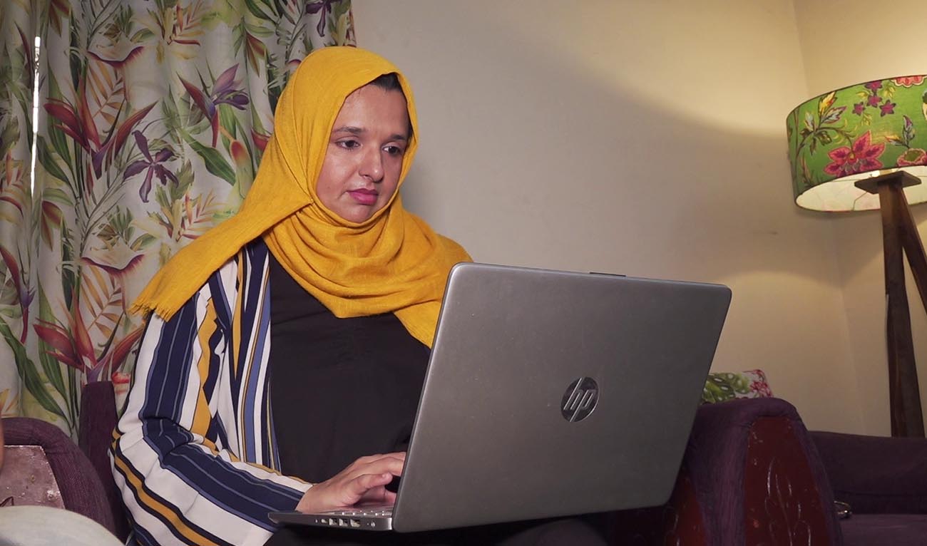 Samina Faisal Khan, founder of ForiFix, a home maintenance services business, working on her laptop on March 7, 2026 in Karachi. (AN Photo)