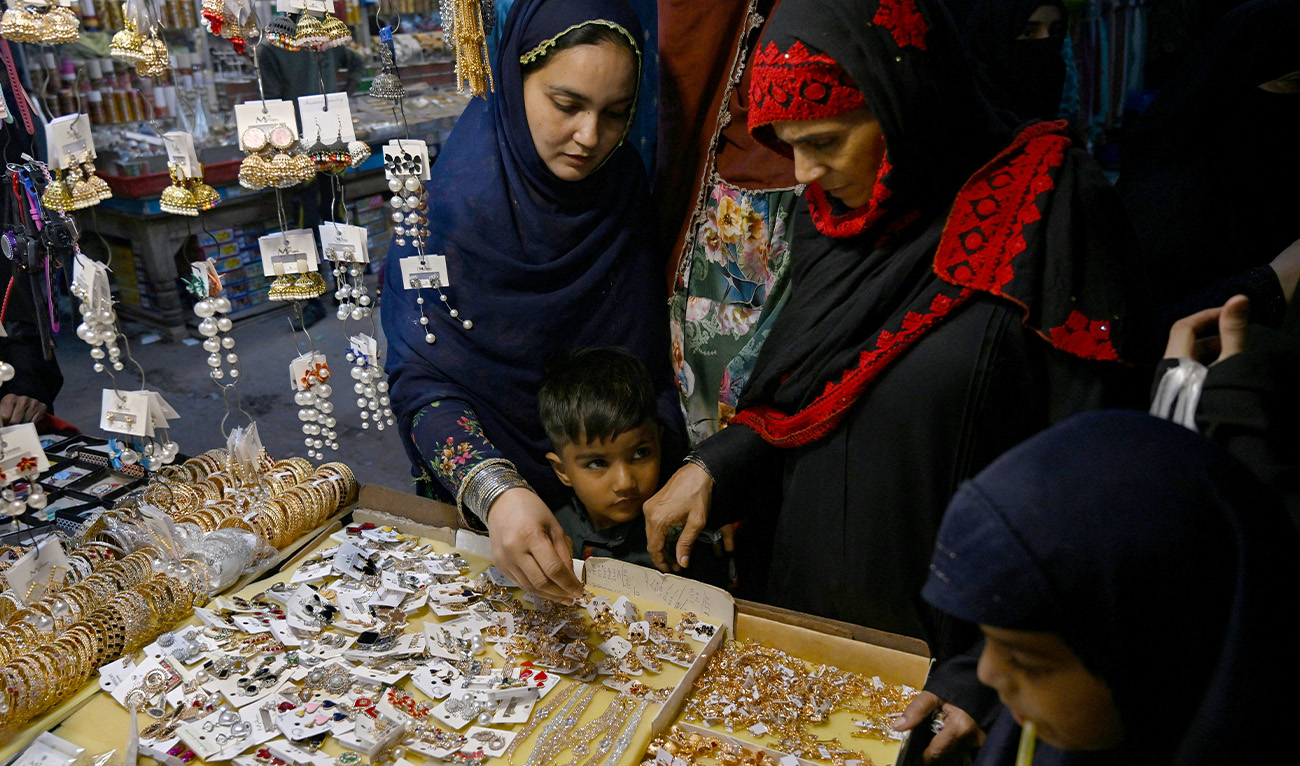 Women shop jewellery at a market in Karachi on March 29, 2025, ahead of Eid al-Fitr, which marks the end of the Islamic holy fasting month of Ramadan. (AFP/File)