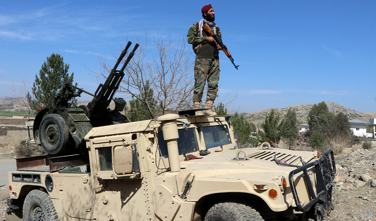A Taliban security personnel stands guard near an anti-aircraft gun while keeping watch for Pakistani airstrikes in the Tere Zayi district of Khost province on March 2, 2026. (AFP)
