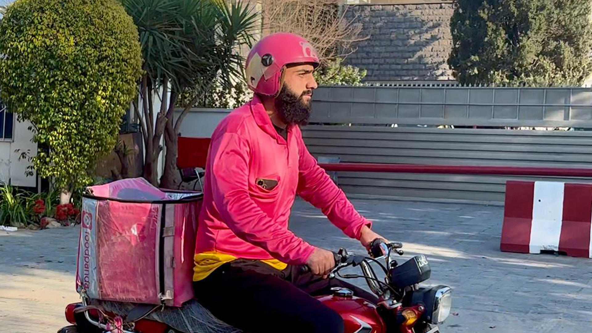 Haji Khan, a Foodpanda rider, rides his motorbike to deliver an order in Islamabad, Pakistan on March 14, 2025. (AN/File)